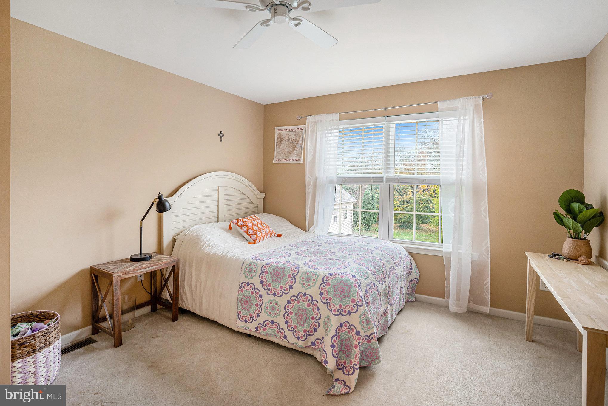 3611 Jacob Stout Road, Unit 8 Doylestown, PA 18902 - Photo 27 of 39 a bedroom with a bed and a window