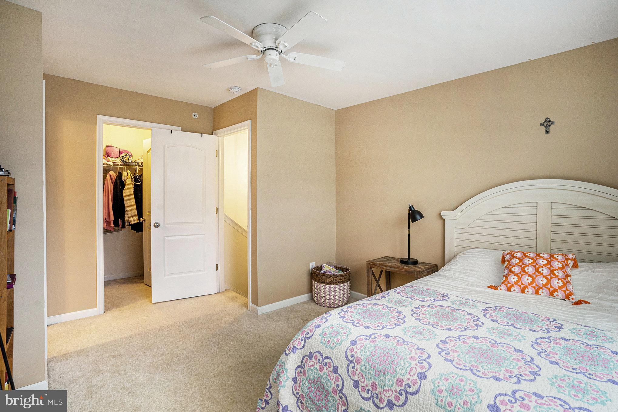 3611 Jacob Stout Road, Unit 8 Doylestown, PA 18902 - Photo 29 of 39 a bedroom with a bed and a chandelier