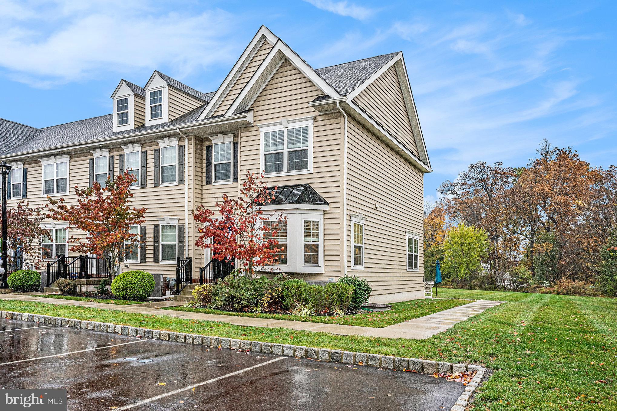 3611 Jacob Stout Road, Unit 8 Doylestown, PA 18902 - Photo 3 of 39 a front view of a house with a yard