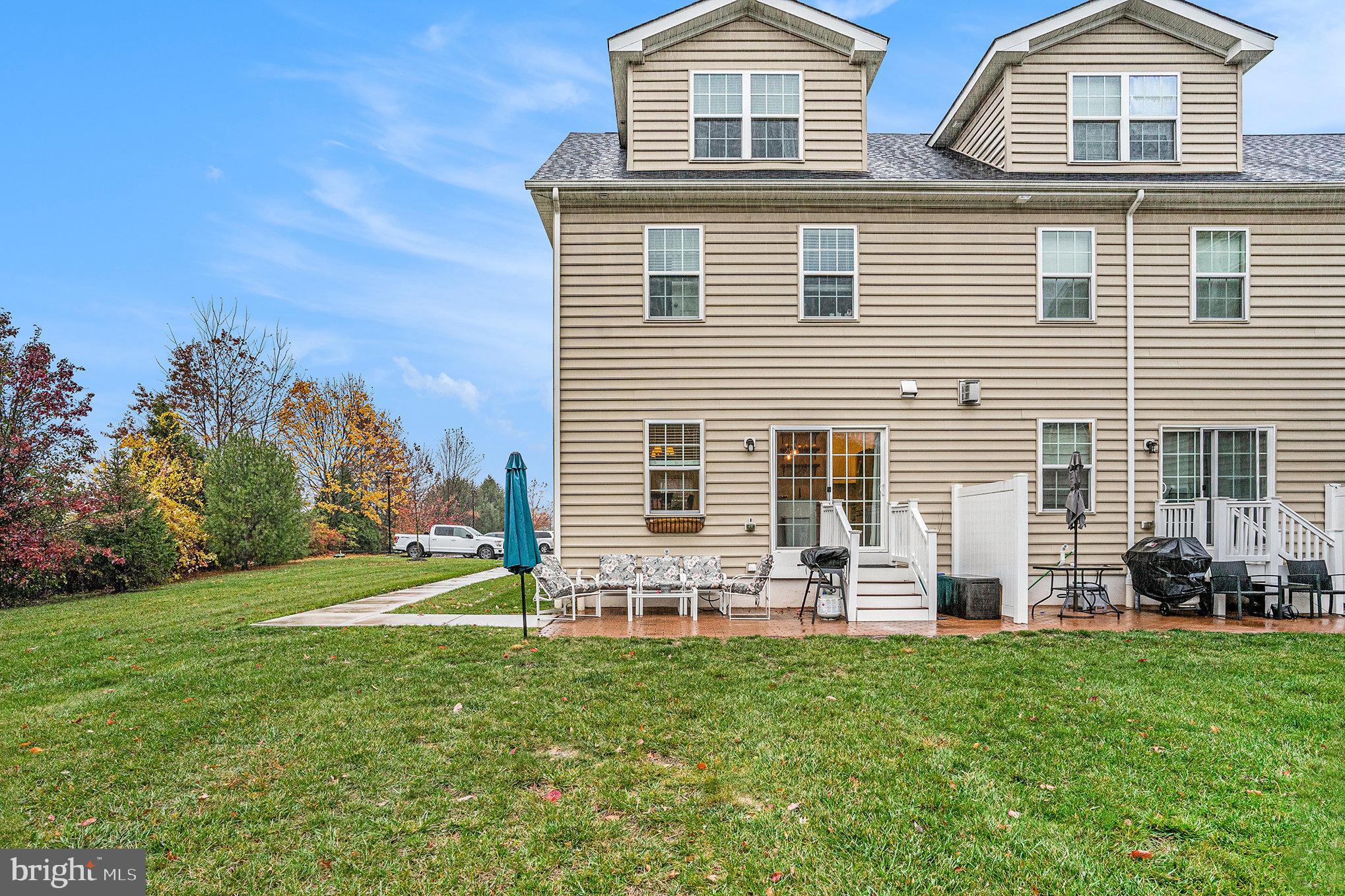 3611 Jacob Stout Road, Unit 8 Doylestown, PA 18902 - Photo 38 of 39 a front view of house with yard and outdoor seating