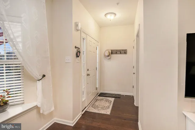 a kitchen with sink cabinets and wooden floor