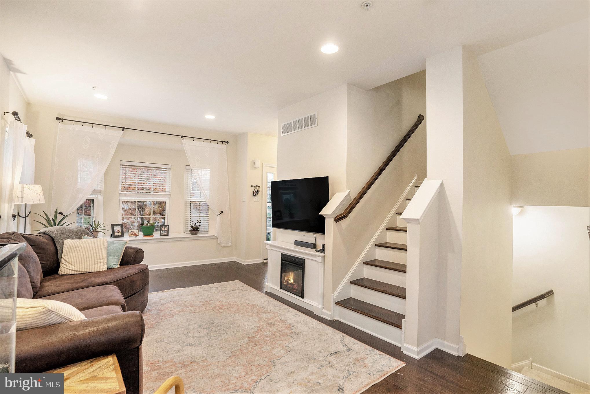 3611 Jacob Stout Road, Unit 8 Doylestown, PA 18902 - Photo 7 of 39 a living room with furniture and a flat screen tv