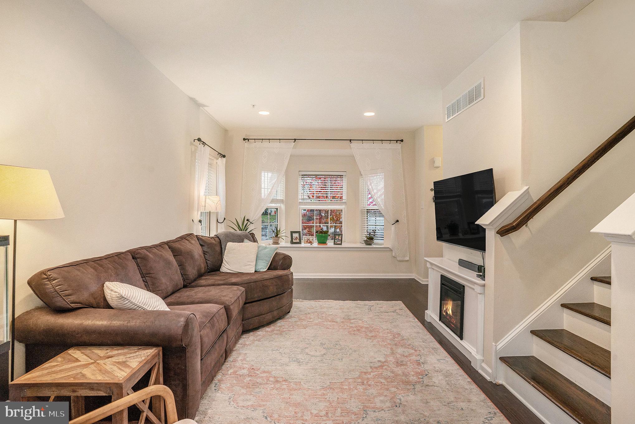 3611 Jacob Stout Road, Unit 8 Doylestown, PA 18902 - Photo 8 of 39 a living room with furniture and a flat screen tv