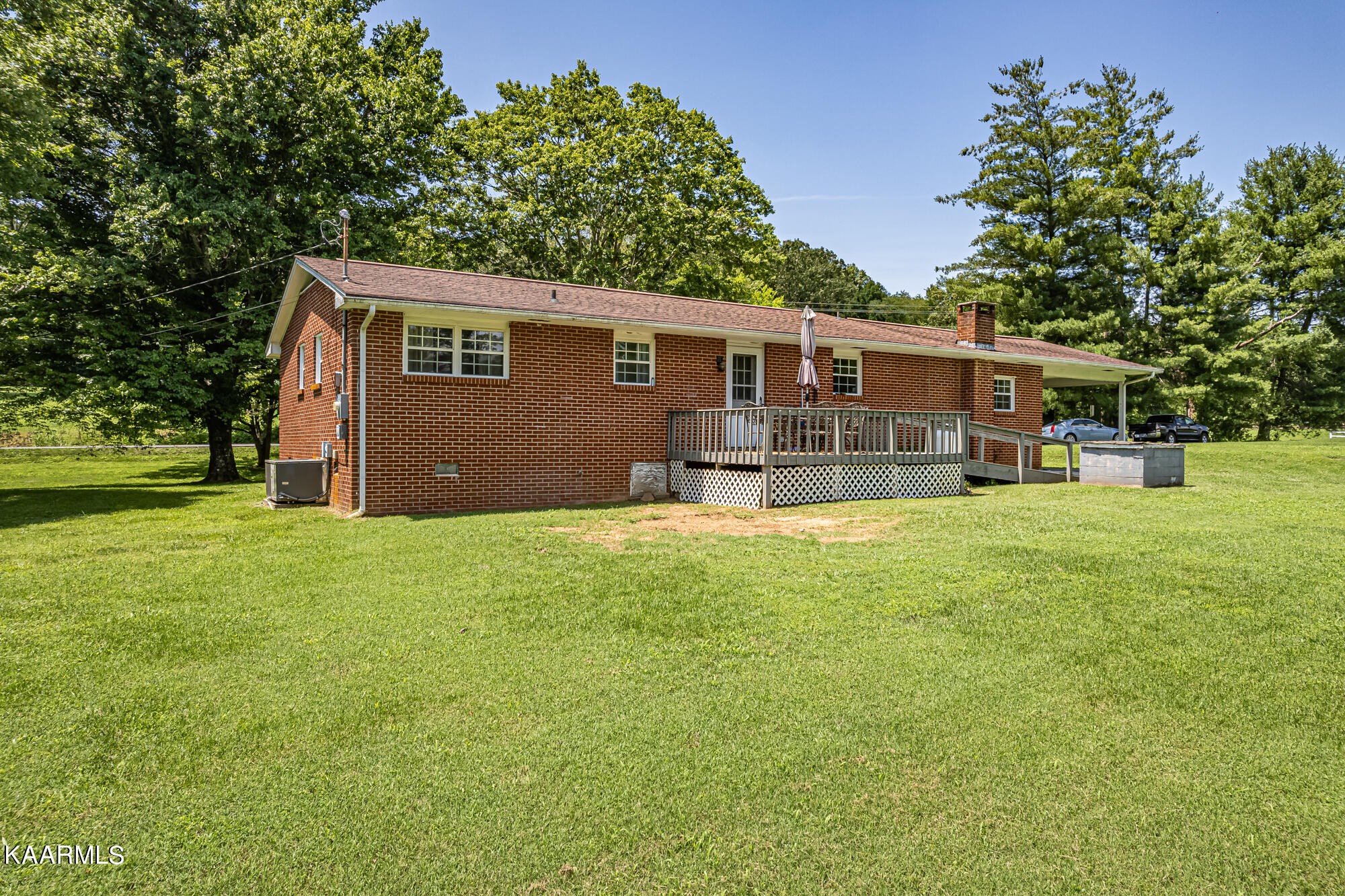 5251 Decatur Highway Ten Mile, TN 37880 - Photo 5 of 49 a backyard of a house with yard and outdoor seating