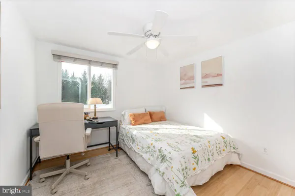 a bedroom with a bed and a mirror