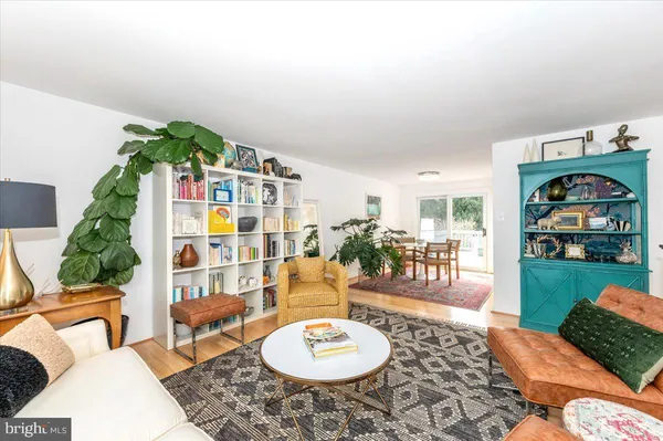 a dining room with furniture and a window