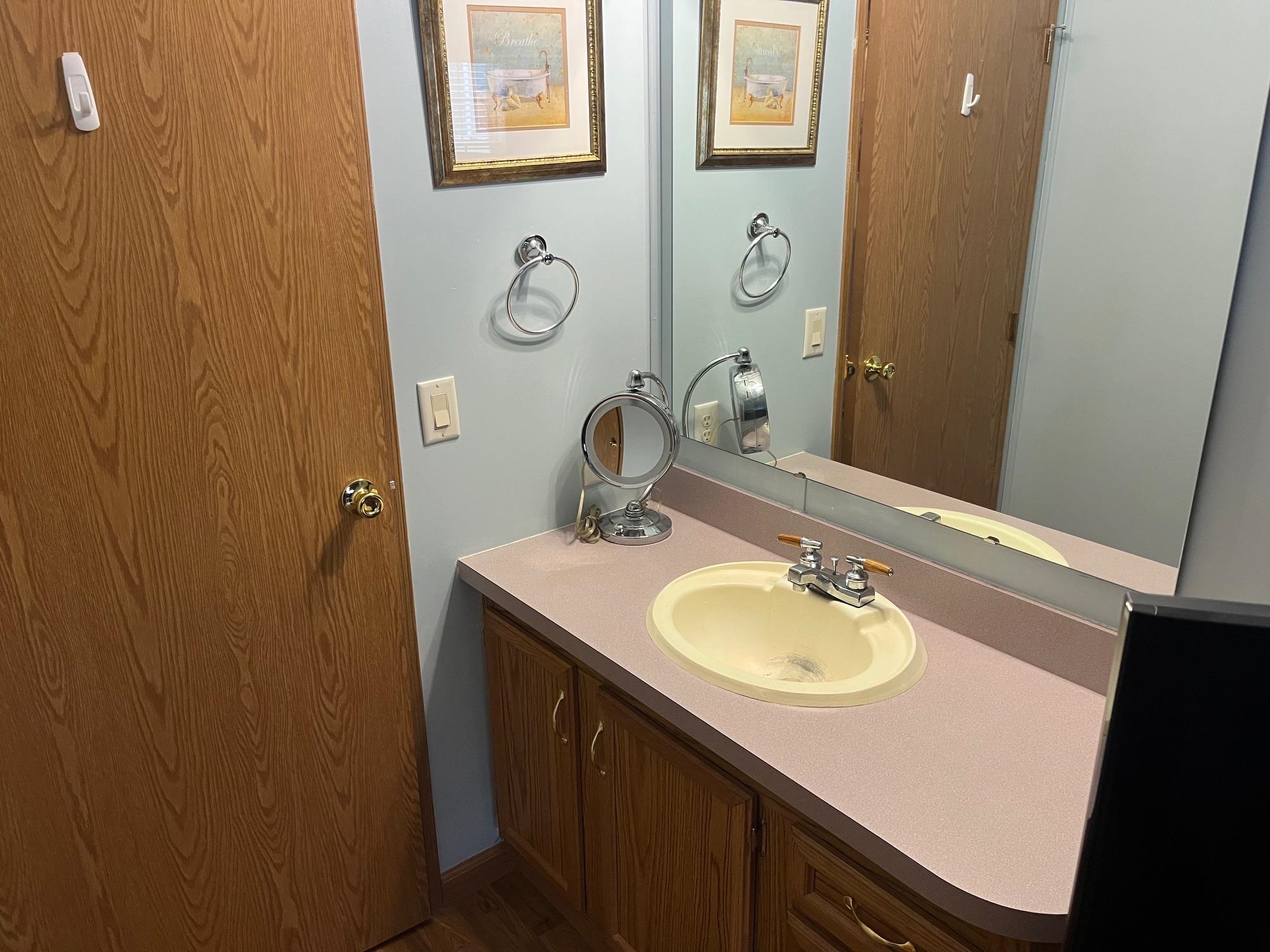 1402 South Rte 9 Cape May Court House, NJ 08210 - Photo 14 of 18 a bathroom with a sink and a mirror