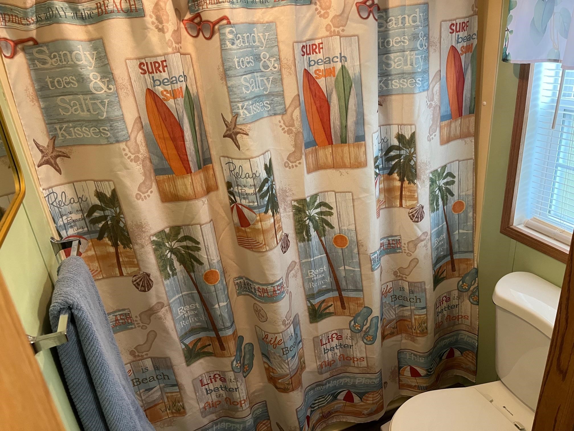 1402 South Rte 9 Cape May Court House, NJ 08210 - Photo 15 of 18 a white toilet sitting next to a bathroom sink