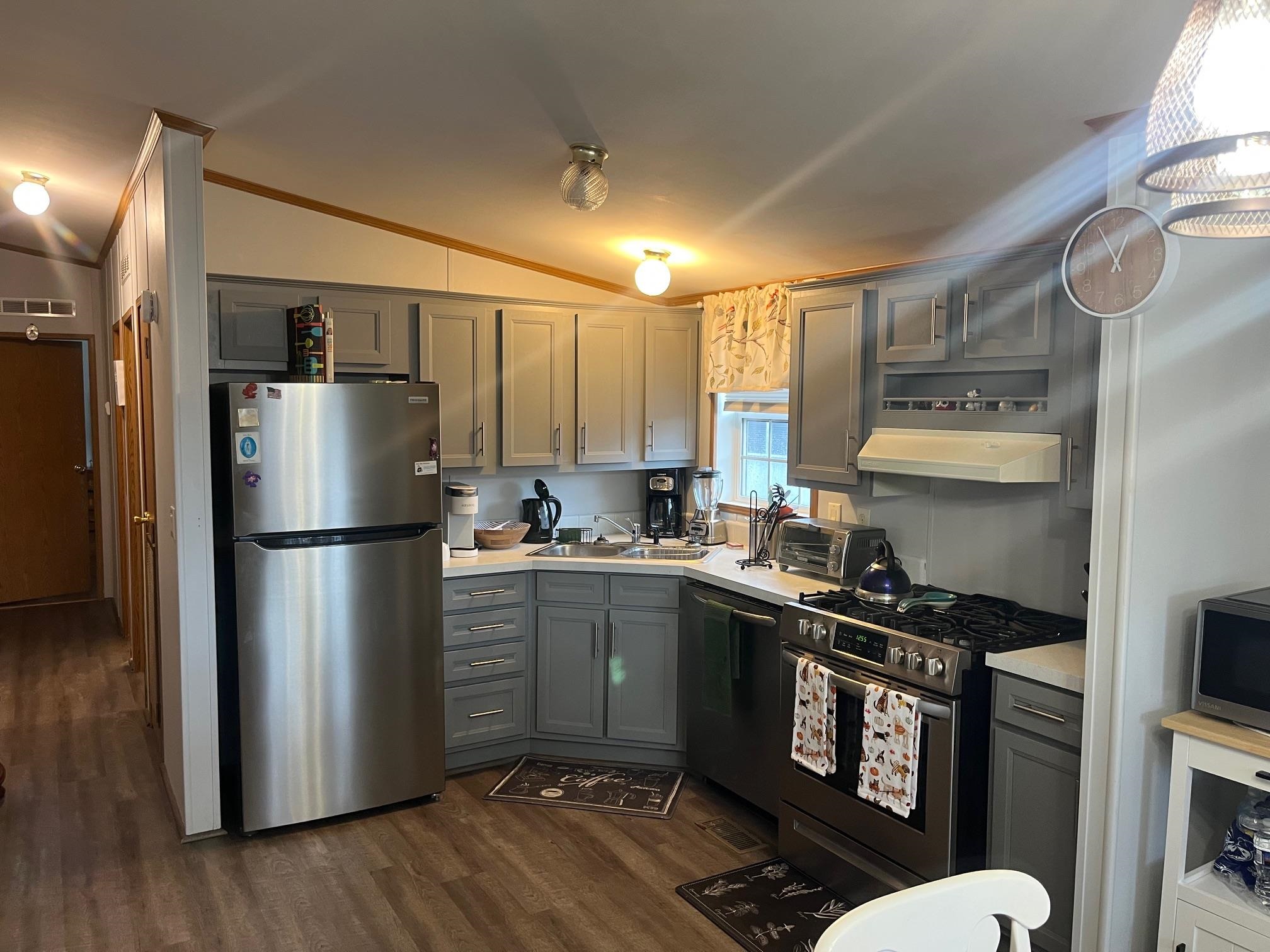 1402 South Rte 9 Cape May Court House, NJ 08210 - Photo 8 of 18 a kitchen with stainless steel appliances a refrigerator a sink and wooden floors