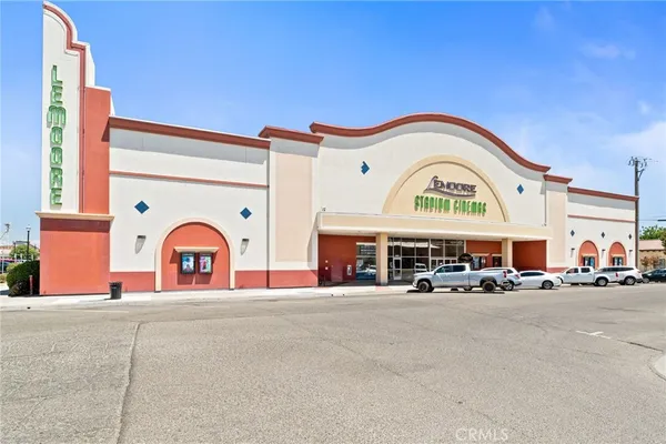 a view of a building with car parked