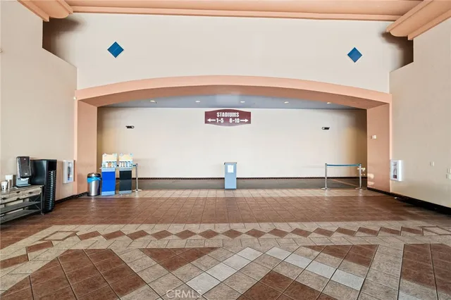 a view of an empty room with windows