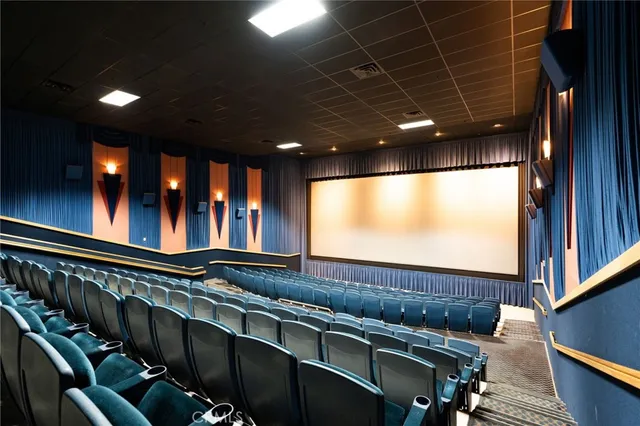 a view of a livingroom with kitchen and furniture