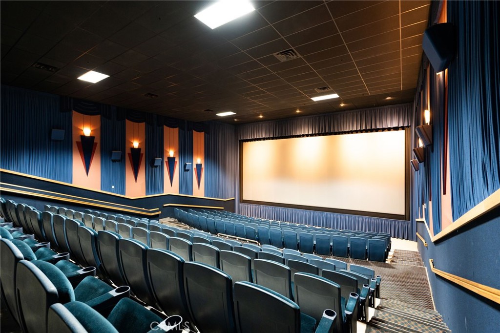 400 Follett Street Lemoore, CA 93245 - Photo 22 of 34 a view of a projector room with projector and furniture
