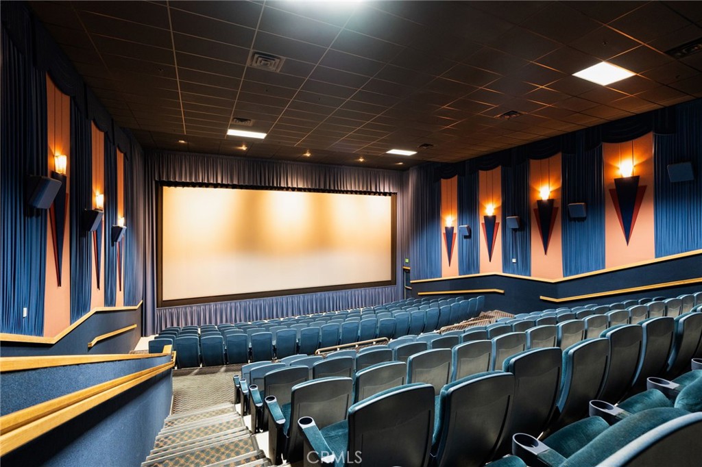 400 Follett Street Lemoore, CA 93245 - Photo 23 of 34 a view of a projector room with furniture and screen