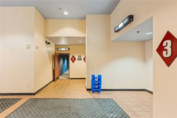 a room with lots of furniture and a large window