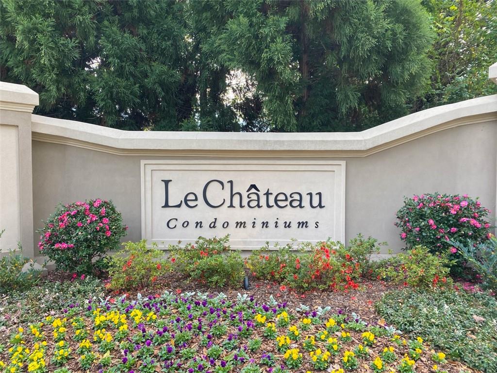 2865 Lenox Road Northeast, Unit 404 Atlanta, GA 30324 - Photo 1 of 1 a sign that is in front of flowers