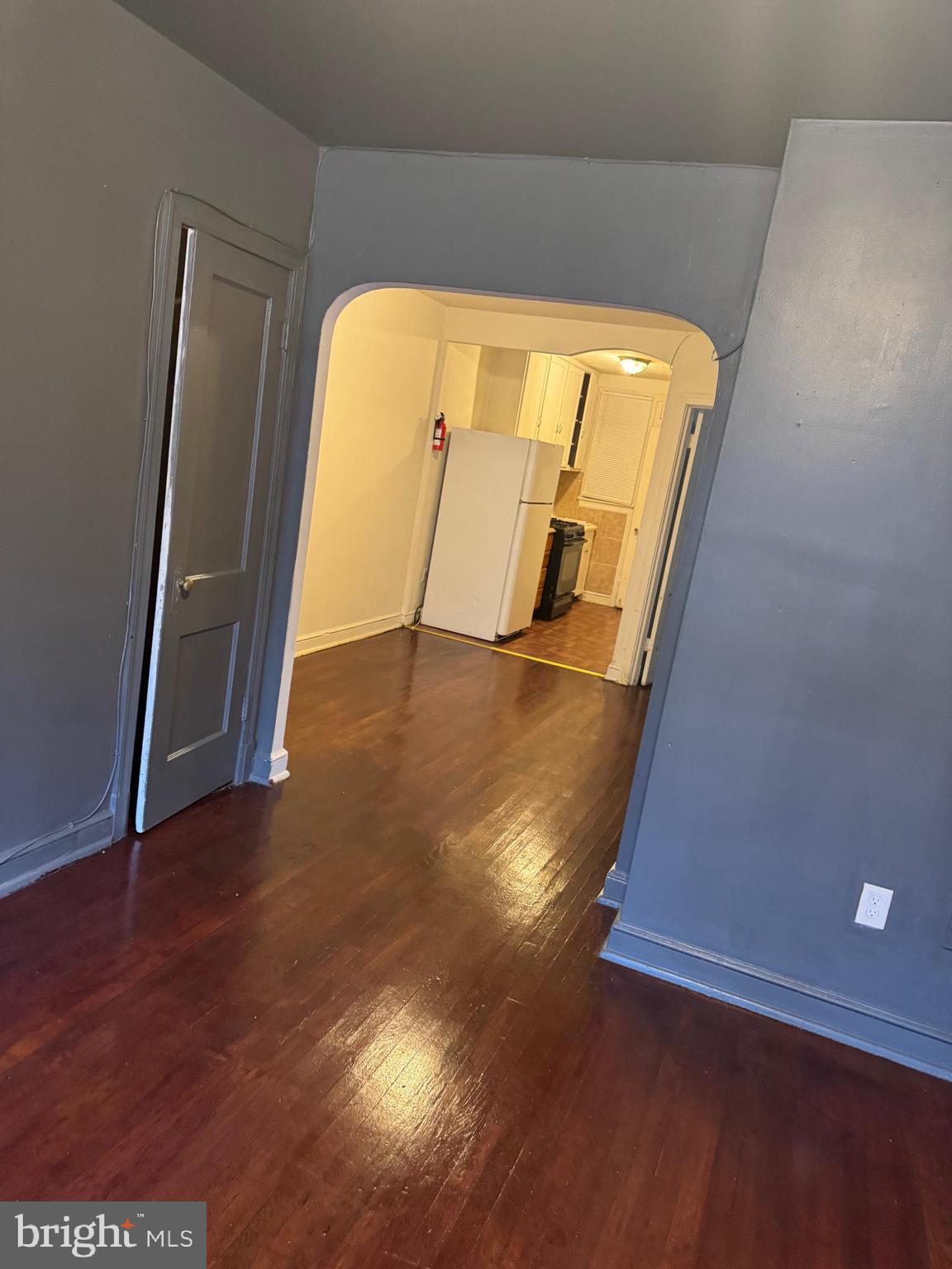 1620 17th Place Southeast Washington, DC 20020 - Photo 3 of 17 a view of an empty room with wooden floor and a window