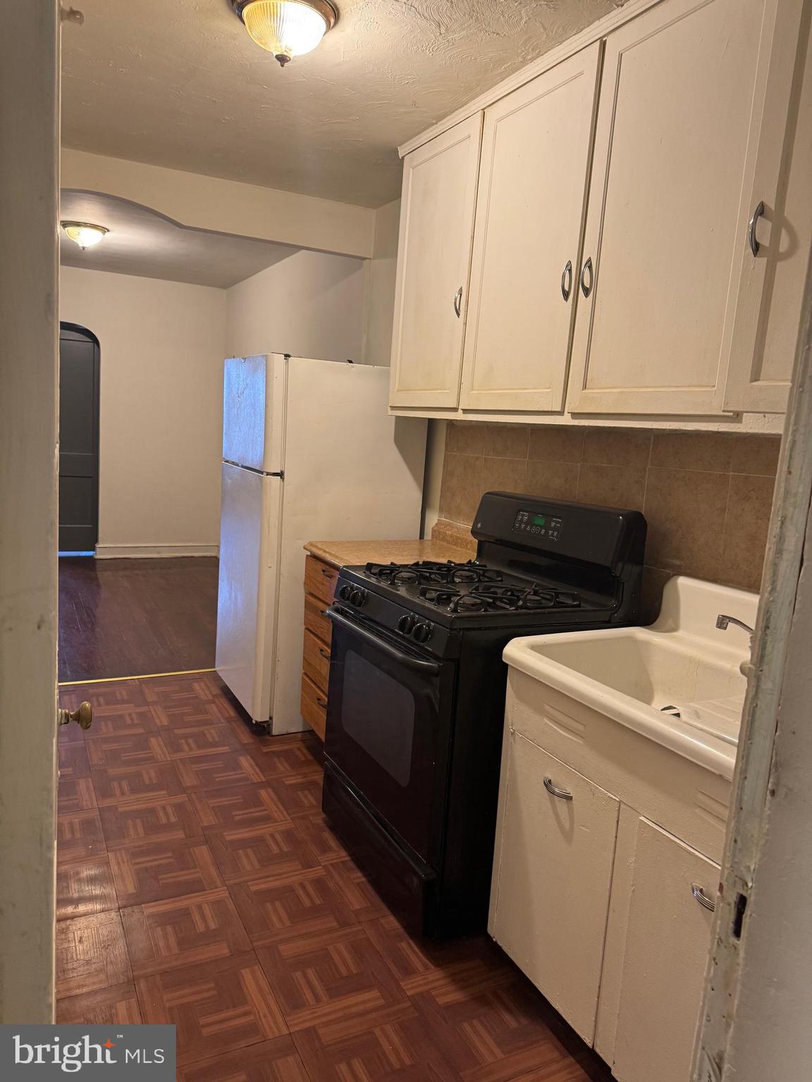 1620 17th Place Southeast Washington, DC 20020 - Photo 5 of 17 a kitchen with a stove and a refrigerator