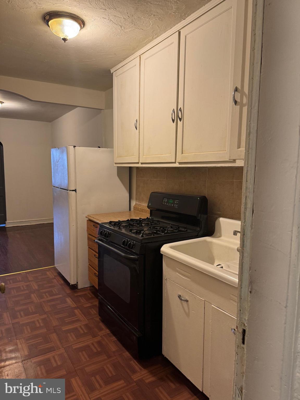 1620 17th Place Southeast Washington, DC 20020 - Photo 6 of 17 a kitchen with a stove and a refrigerator
