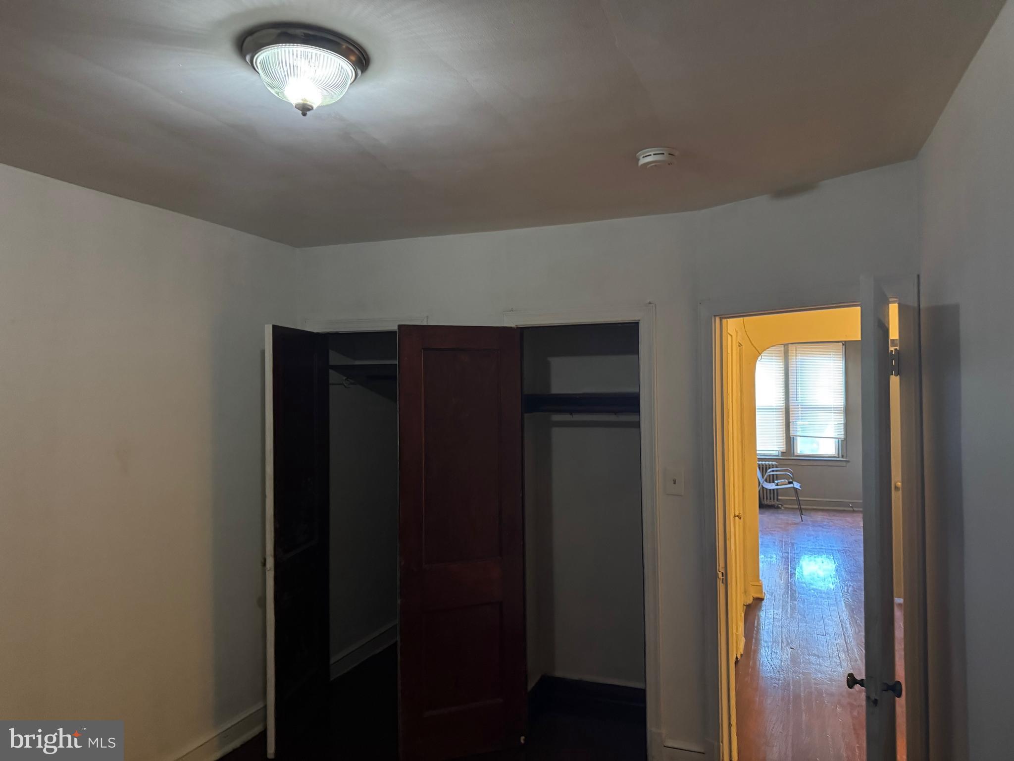 1620 17th Place Southeast Washington, DC 20020 - Photo 9 of 17 wooden floor in an empty room with a window