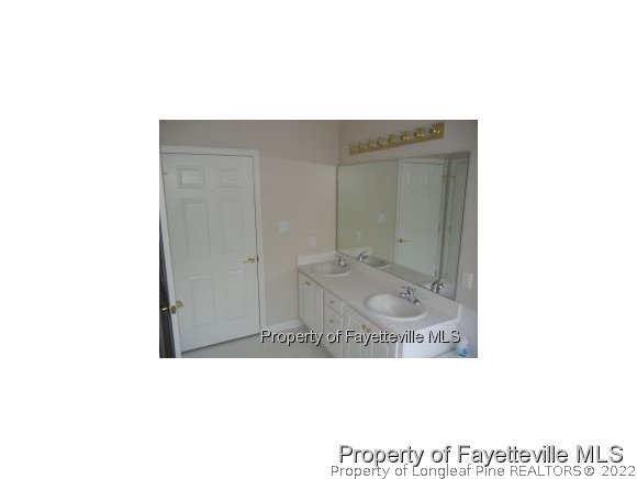 532-7 Lionshead Road Fayetteville, NC 28311 - Photo 14 of 21 a bathroom with a sink and mirror