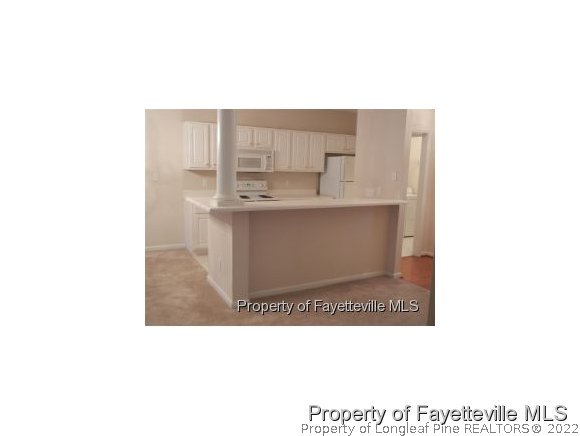 532-7 Lionshead Road Fayetteville, NC 28311 - Photo 21 of 21 a open kitchen with a sink and cabinets