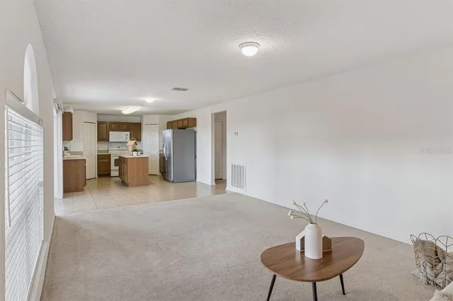 a view of a livingroom with furniture and a chandelier