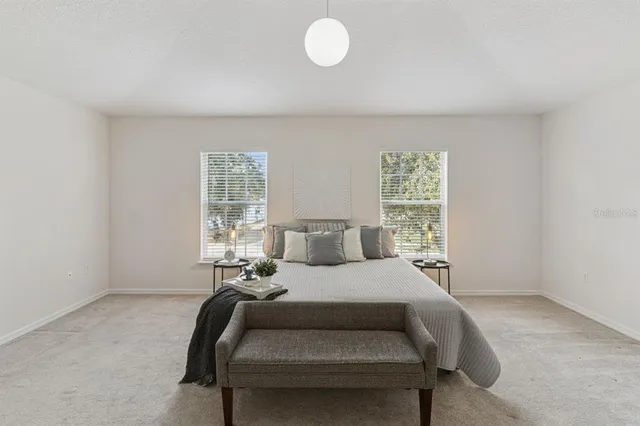 a bed room with a bed and a window