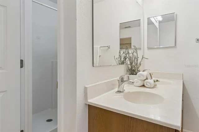 a bedroom with a bed and a lamp