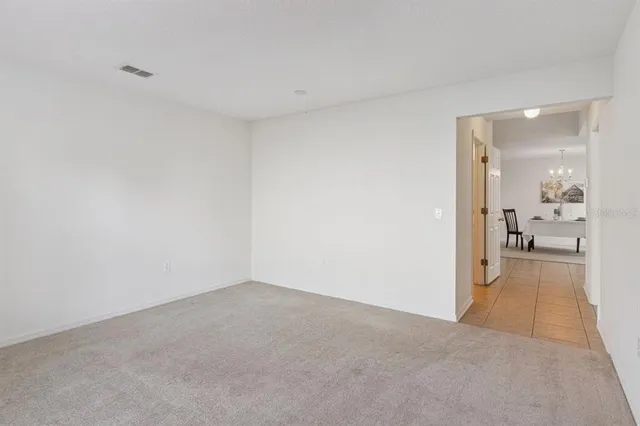 a view of a big room with wooden floor and a bathroom