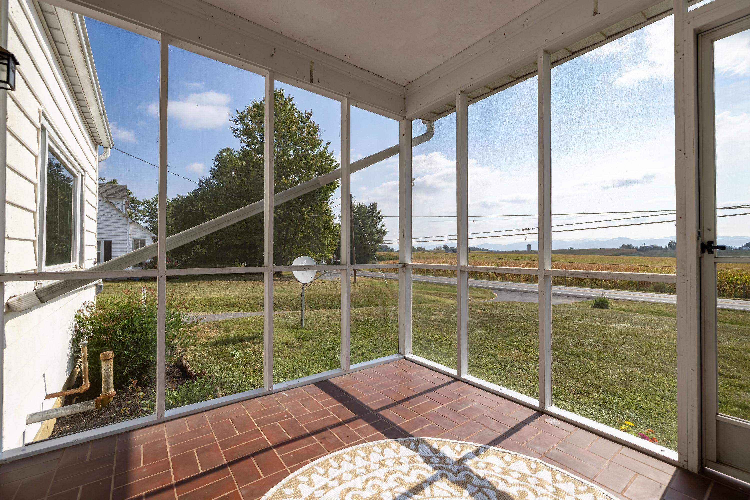 3138 Cross Keys Road Harrisonburg, VA 22801 - Photo 34 of 74 The large screened in porch features beautiful views of the nearby mountains and plenty of space for furniture and enjoying friends and family.