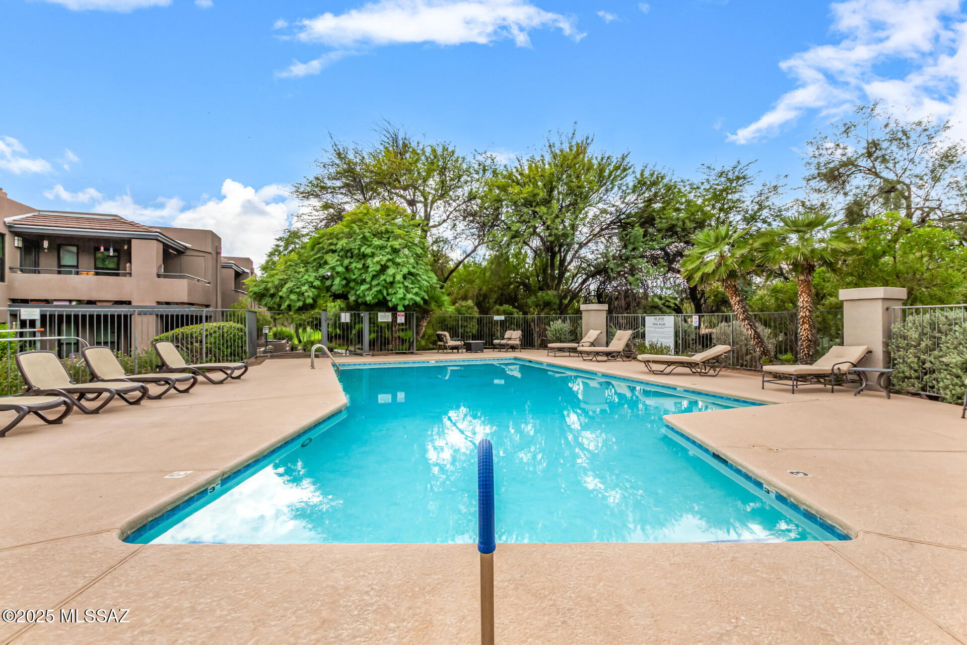 5855 North Kolb Road, Unit 8102 Tucson, AZ 85750 - Photo 18 of 28 a view of a swimming pool with a patio