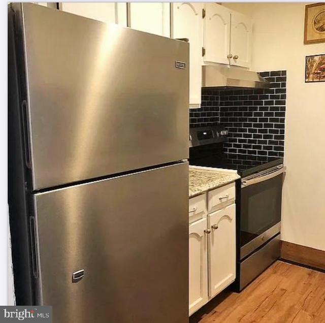 25 South Church Road, Unit 38 Maple Shade, NJ 08052 - Photo 11 of 20 a close view of a refrigerator in kitchen with stainless steel appliances wooden floor