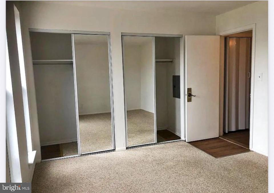 25 South Church Road, Unit 38 Maple Shade, NJ 08052 - Photo 14 of 20 an empty room with closet and wooden floor