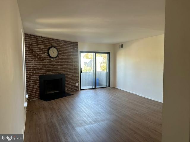 25 South Church Road, Unit 38 Maple Shade, NJ 08052 - Photo 3 of 20 a view of empty room with wooden floor and fireplace