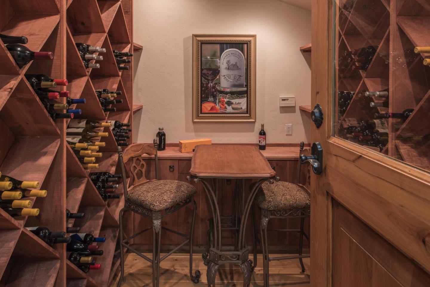 3025 Bird Rock Road Pebble Beach, CA 93953 - Photo 13 of 25 a view of a dining room with furniture and chandelier