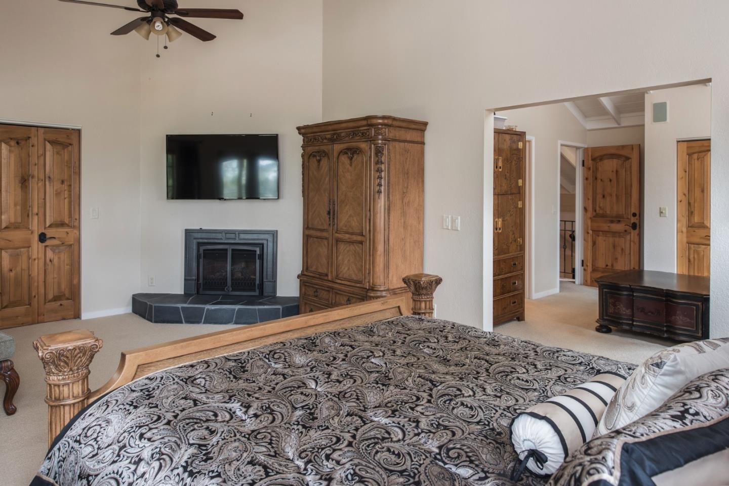 3025 Bird Rock Road Pebble Beach, CA 93953 - Photo 16 of 25 a bedroom with a bed and a television