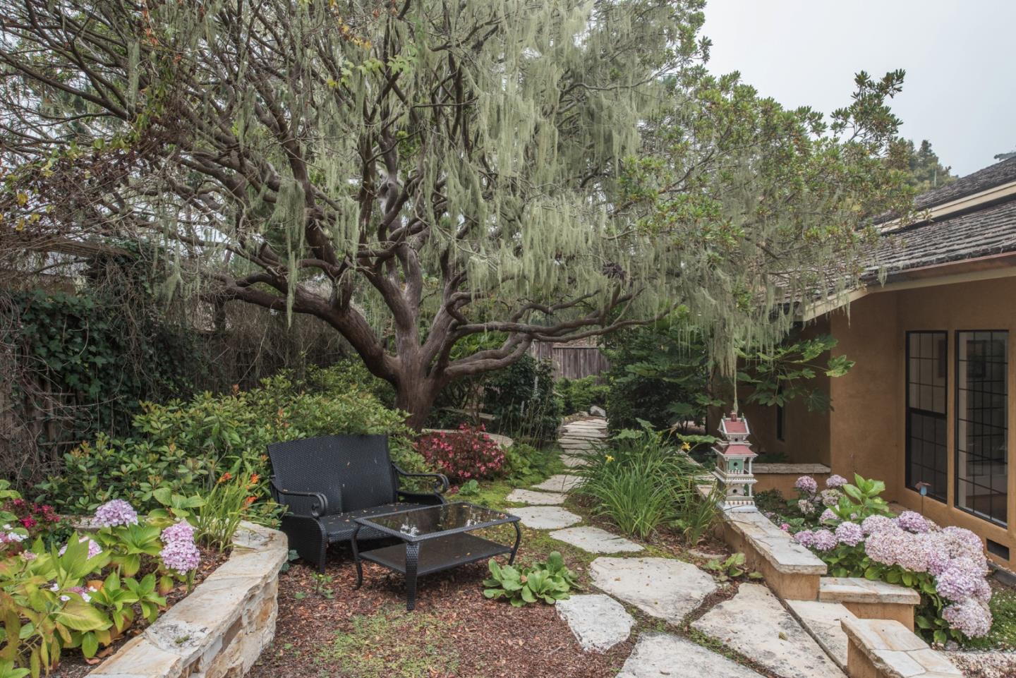 3025 Bird Rock Road Pebble Beach, CA 93953 - Photo 23 of 25 a backyard of a house with outdoor seating