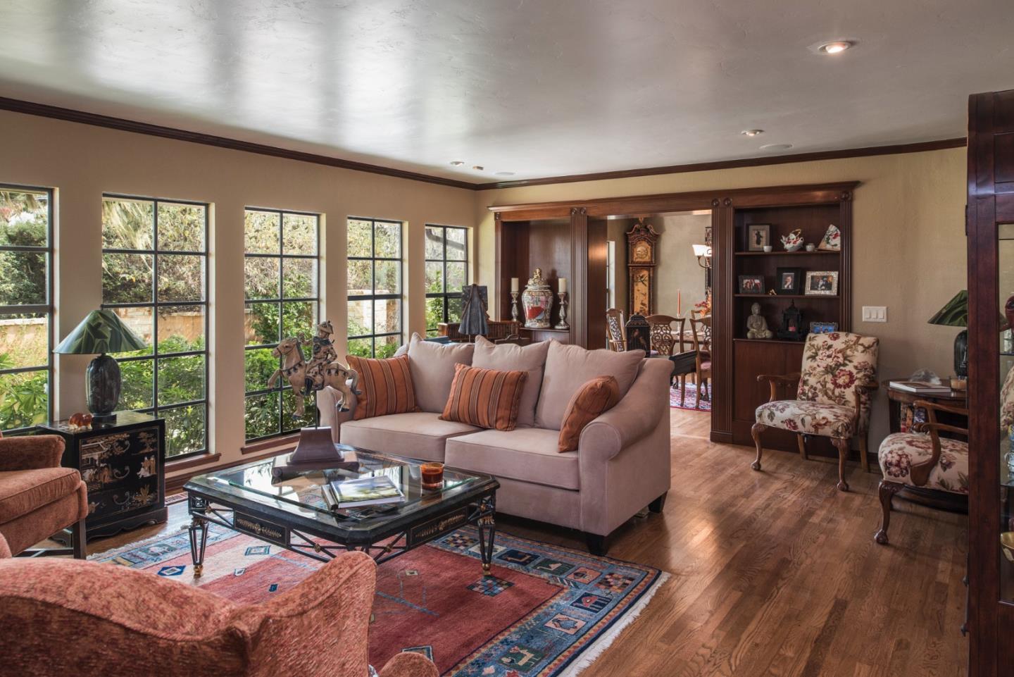 3025 Bird Rock Road Pebble Beach, CA 93953 - Photo 3 of 25 a living room with furniture large windows and wooden floor