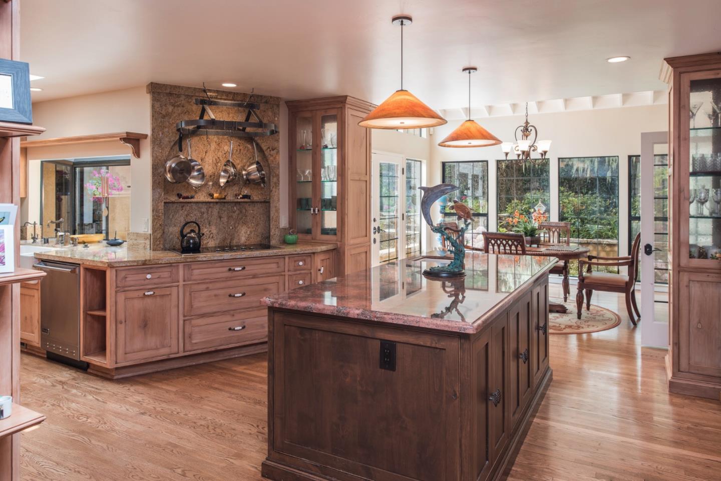 3025 Bird Rock Road Pebble Beach, CA 93953 - Photo 6 of 25 a dining hall with stainless steel appliances kitchen island granite countertop a stove a sink and a living room view
