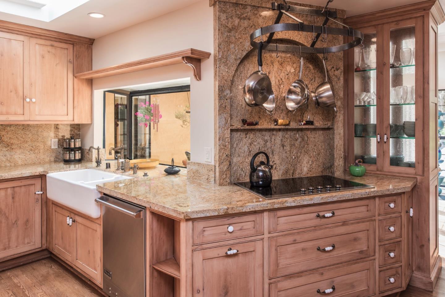 3025 Bird Rock Road Pebble Beach, CA 93953 - Photo 7 of 25 a kitchen with a sink and cabinets
