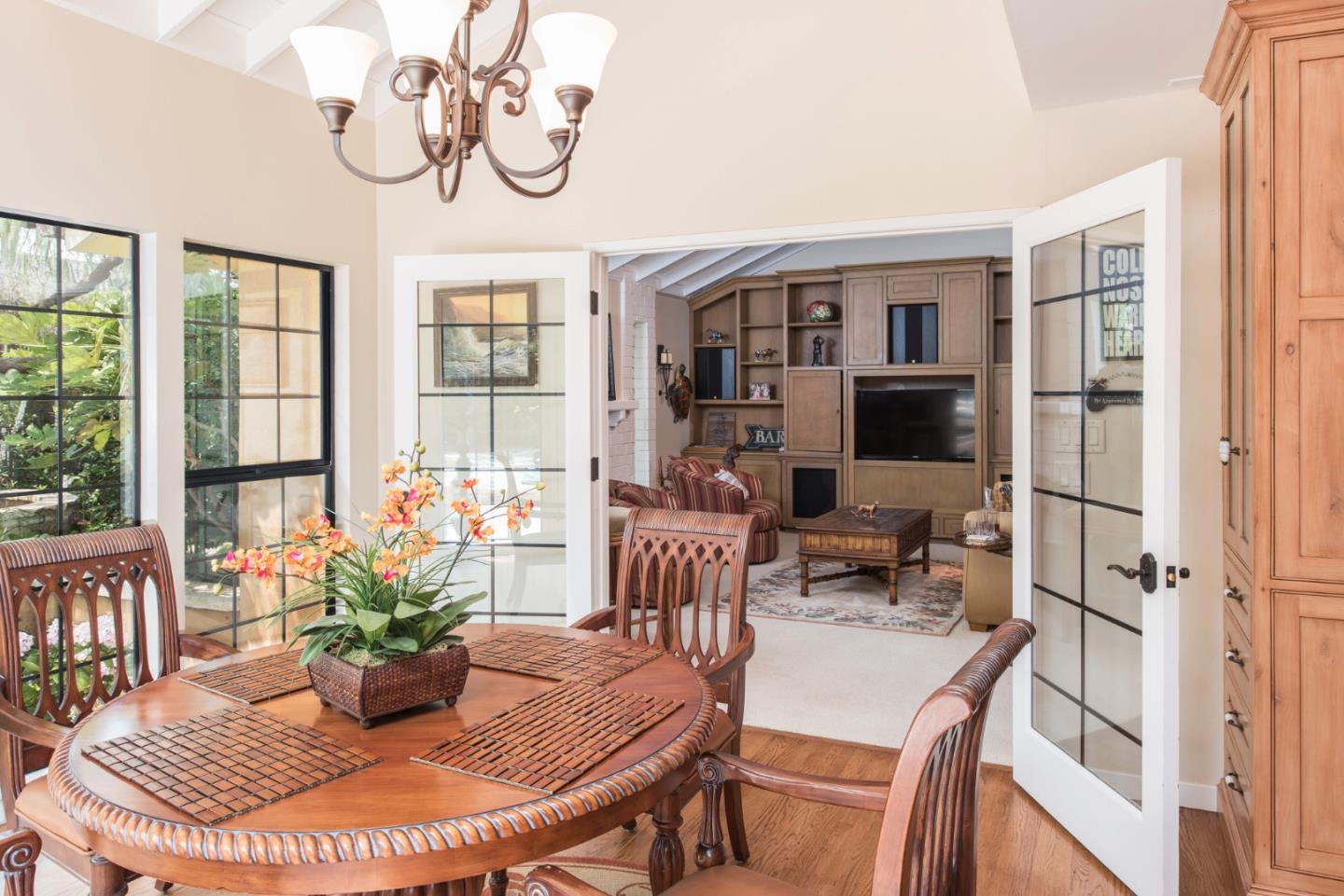 3025 Bird Rock Road Pebble Beach, CA 93953 - Photo 10 of 25 a dining room with furniture potted plants and wooden floor