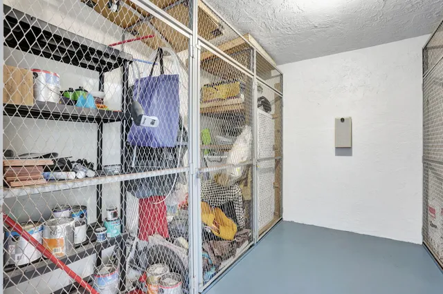 a view of a patio with a table and chairs and potted plants