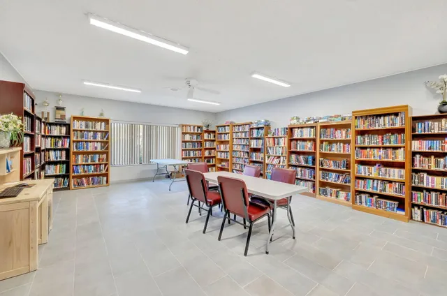 a view of a swimming pool with a yard