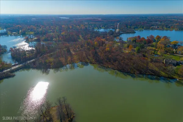 aerial view of a house with a lake view