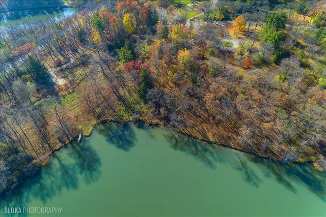 a view of yard covered with snow in front of house
