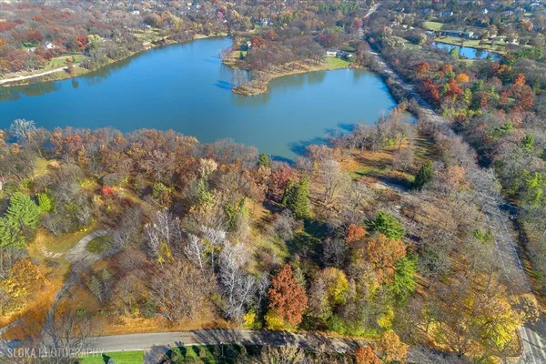 an aerial view of a house with a yard