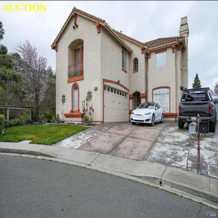 a car parked in front of white house