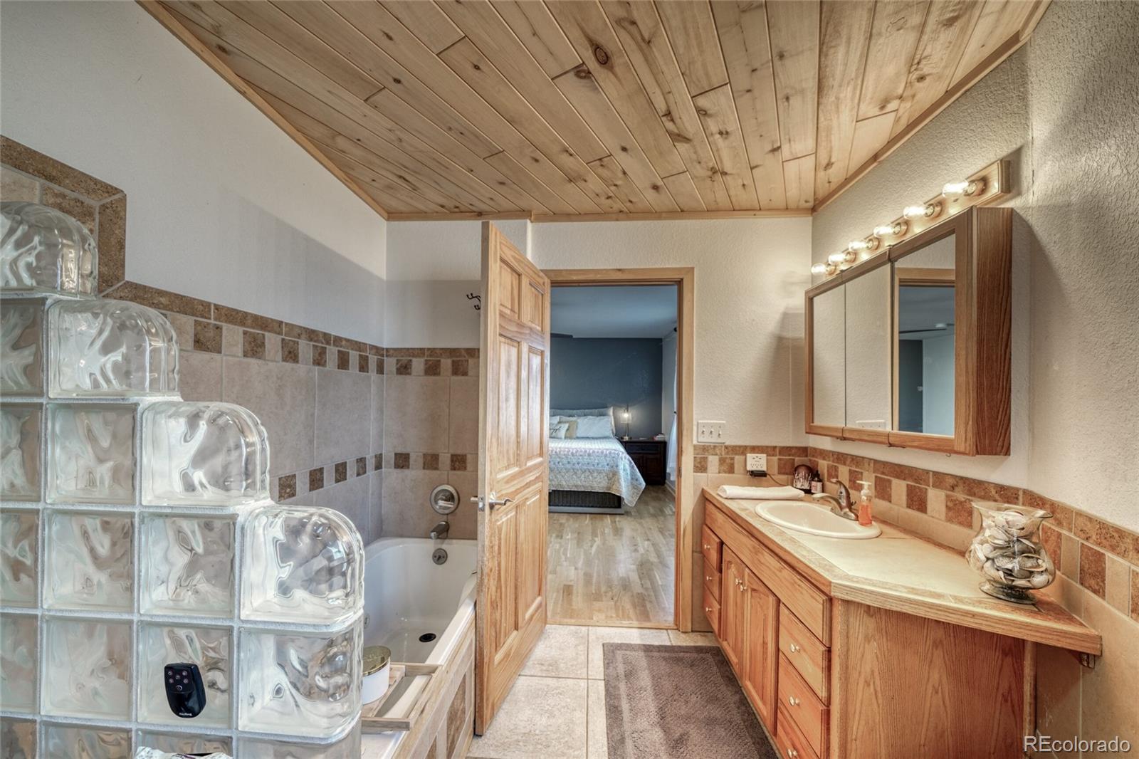 50 Rex Circle Salida, CO 81201 - Photo 16 of 50 a spacious bathroom with a double vanity sink and a mirror