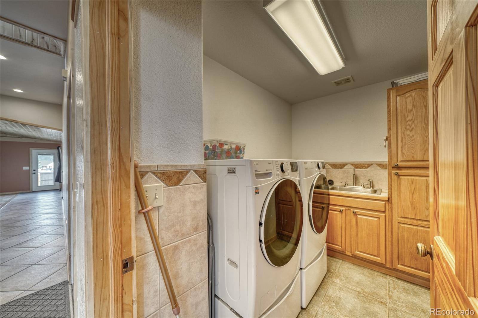 50 Rex Circle Salida, CO 81201 - Photo 17 of 50 a utility room with dryer and washer